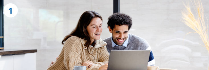 Couple looking at a laptop
