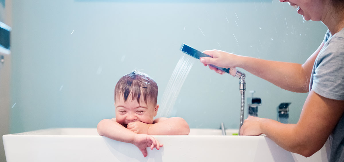 Mother bathing her child